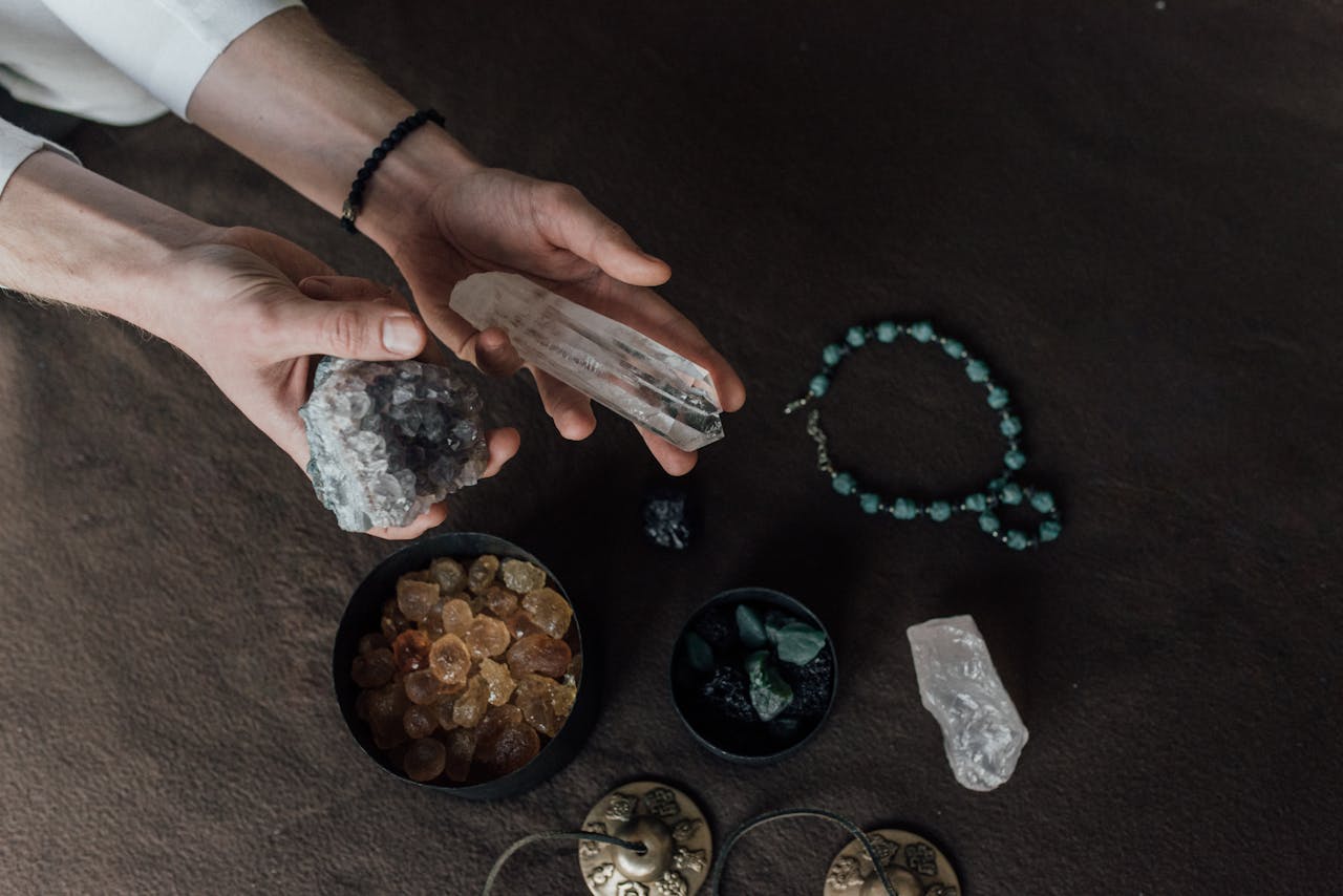 Mastering the First Impression: Your intriguing post title goes here Close-up of hands holding various healing crystals for alternative therapy and meditation.